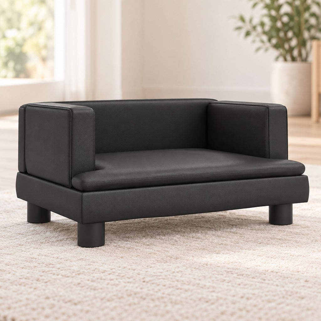 La banquette en simili noir seule, vue de trois quarts avant gauche, ses quatre pieds cylindriques et son grand côté ouvert bien visibles.