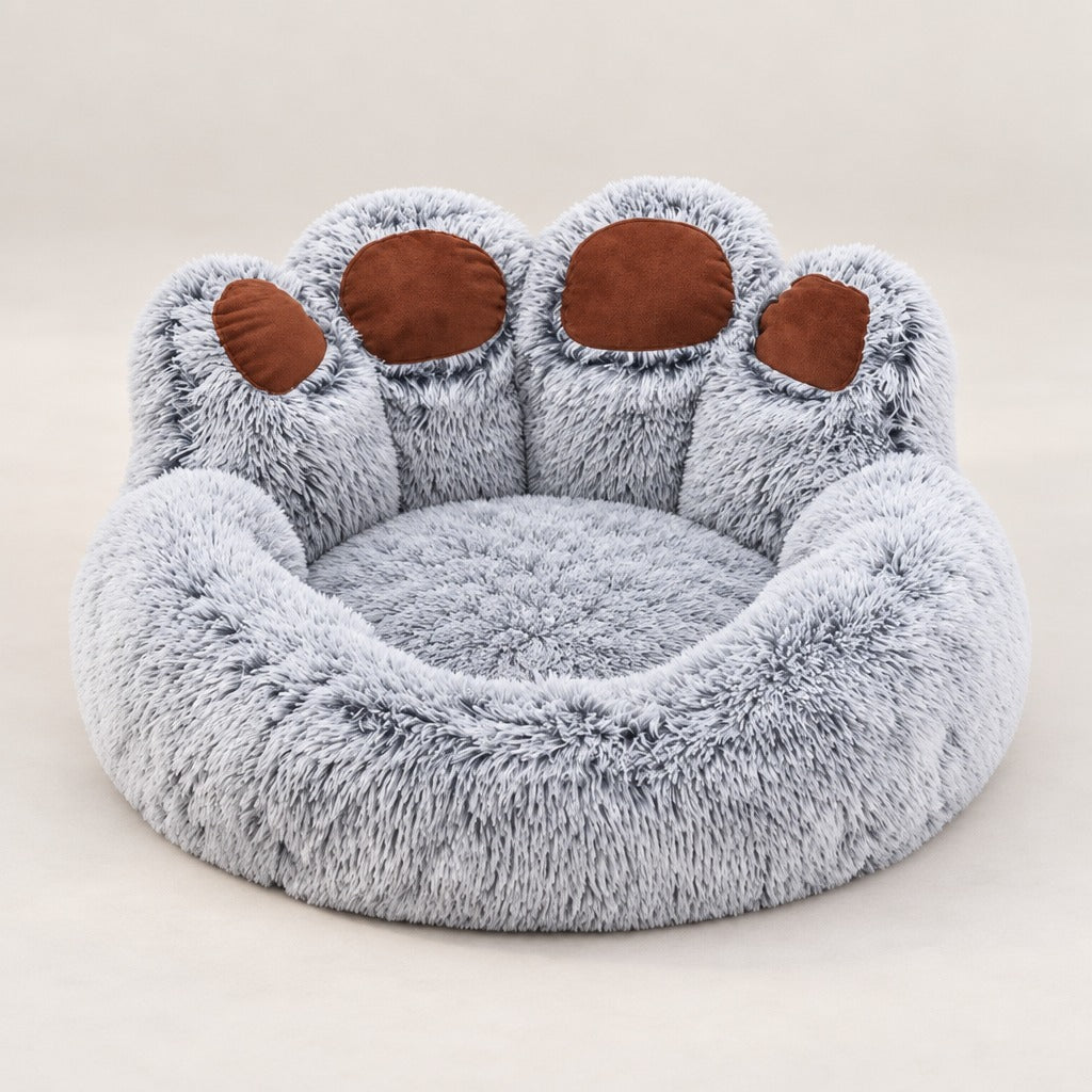 Le couchage pour chien gris givré seul, vu de trois quarts, dossier en patte à quatre lobes.