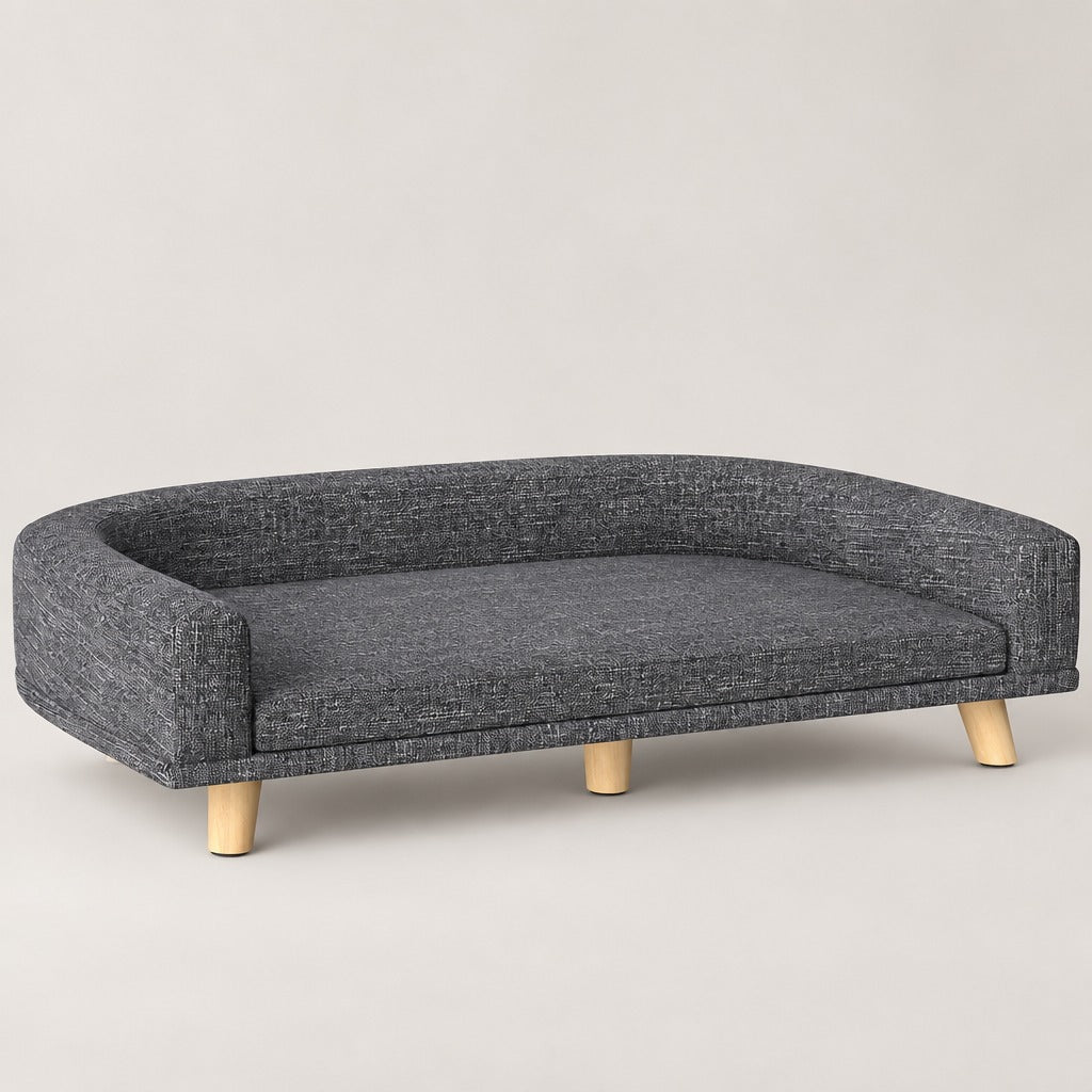 Le sofa ardoise chiné pour chien, vu de trois quarts et seul, sur un fond neutre.